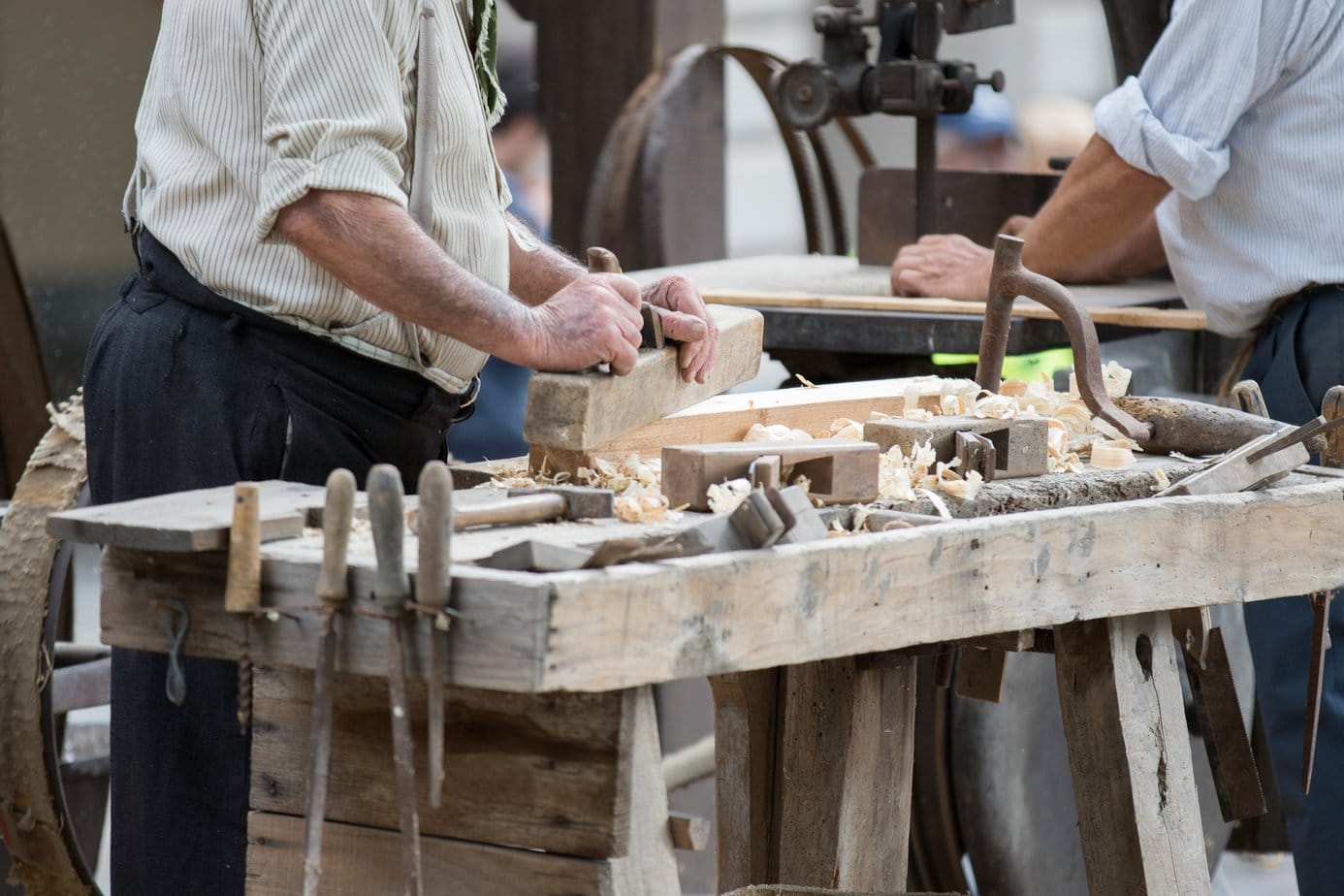 carpenter works wood with its tools