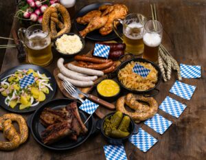 Oktoberfest dishes with beer, pretzel and sausage