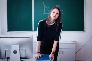 teacher teaches a lesson at the table
