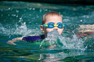 Kid swim in the pool